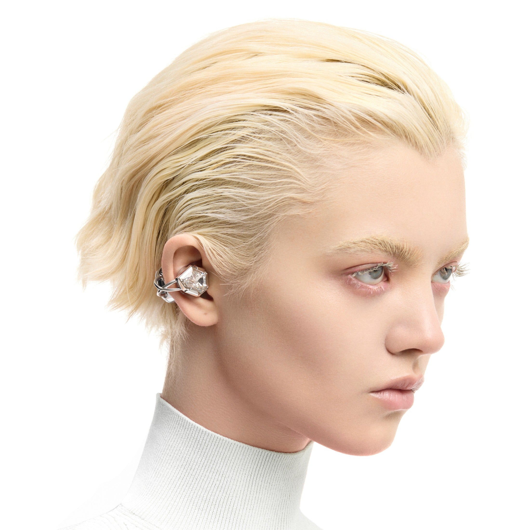 OF HUNGER Electronic Gems silver-white zircon earphones worn as jewelry-like ear accessories on a model