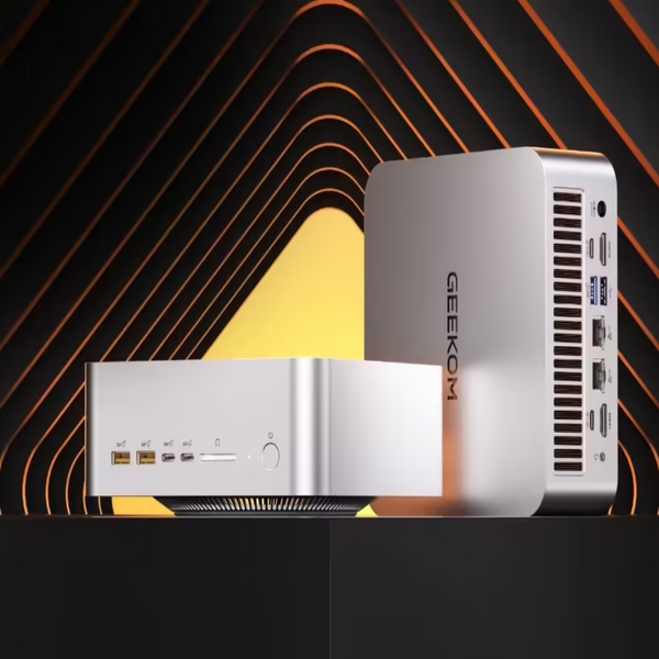 Two computer cases with 'GEEKOM' branding on a black background with orange and yellow gradient.
